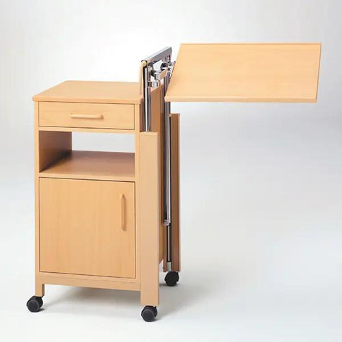 Ein Nachtschrank mit verstellbarem Tisch und Schubladen die Stauraum bieten. Alles auf vier bewegliche Rollen und Holzverkleidung.jpg